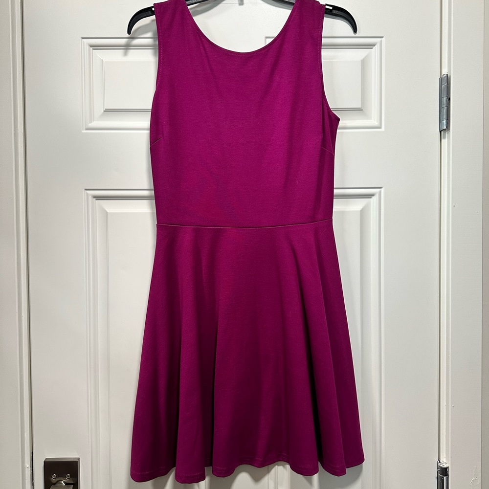 Magenta dress with detailed back. Brand new! Size L